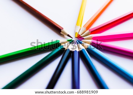 Colored pencils in a circle, at an angle