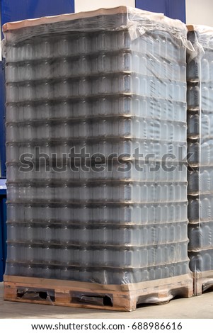 pallet with glass jars for preservation or liquid food, the packed party for transportation.