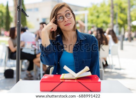 young woman thinking at university