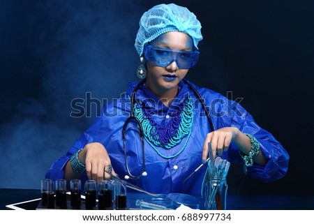 Chemistry Asian Doctor Woman with Blue Tone Fashion Make up fancy lab test dress, studio lighting black dark background, safety gear hygiene hat and tube glass