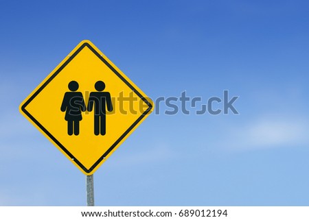 Man and lady icon, Man and lady toilet sign on yellow label, warning signs,Traffic signs, isolated on the sky background