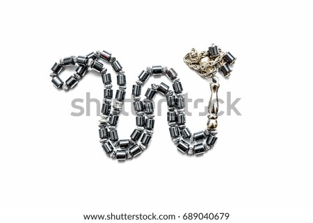 Closeup of tasbih or rosary isolated on a white background. 