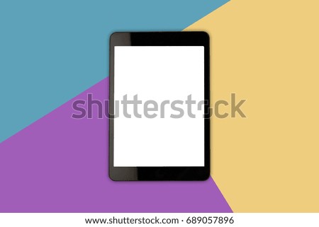 Digital tablet with blank screen on colorful background