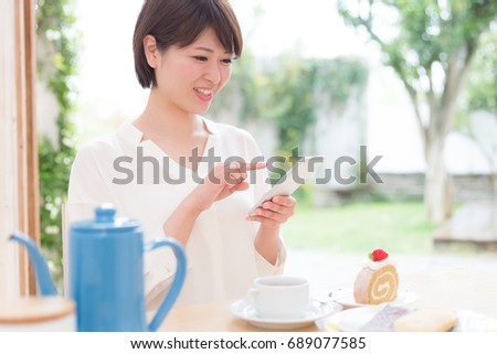 asian young woman at a cafe.