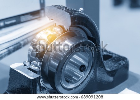 The metal  ball bearing spare part in the section cut .The hi-precision mechanical part. Royalty-Free Stock Photo #689091208
