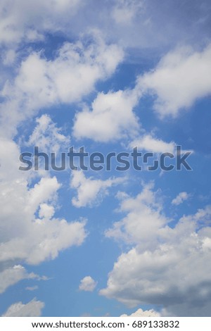 Blue sky with white clouds. Day, background.