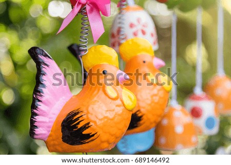 Colorful animal ceramic doll hanging in the garden