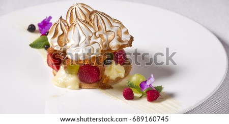 Lemon pie with fruit and berries