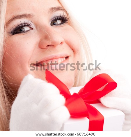 Woman holding gift. Christmas woman portrait of a cute, beautiful smiling Caucasian model.