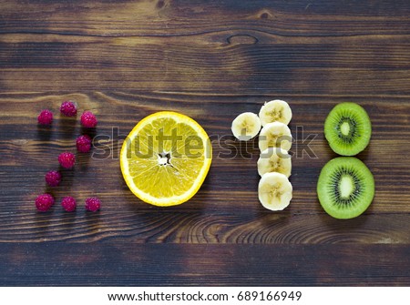 happy new year 2018 of fruit and berries on wooden background Royalty-Free Stock Photo #689166949