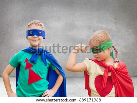 Digital composite of Superhero kids with blank grey background