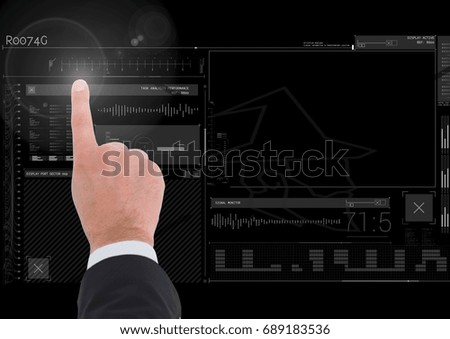 Digital composite of Hand touching user interface technology graphics