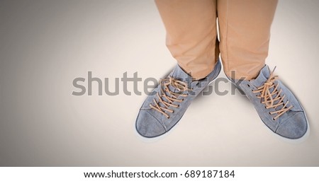 Digital composite of Man's feet and shoes on grey background