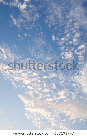 The texture of the clouds against the blue sky