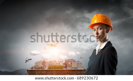 Woman presenting construction project. Mixed media
