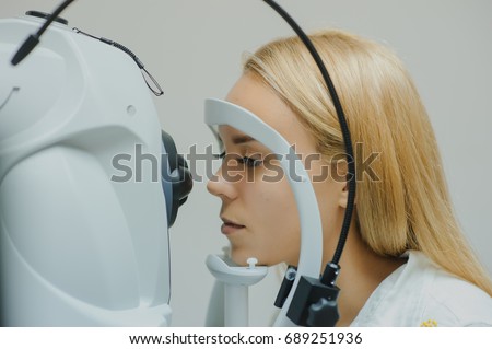 close up head of young patient fix in Tomography in Optical Coherence (OCT) equipment. Royalty-Free Stock Photo #689251936