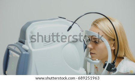 close up head of young patient fix in Tomography in Optical Coherence (OCT) equipment. Royalty-Free Stock Photo #689251963