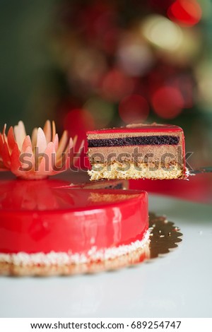 a piece of red cake, the new year. cut cake
