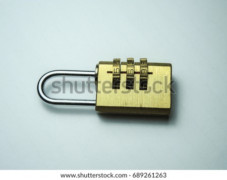 Combination lock.Golden color, white background image
