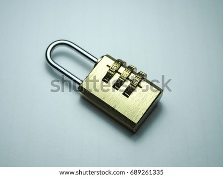 Combination lock.Golden color, white background image