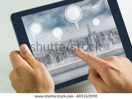 Digital composite of Holding tablet and City with  marker location pointers