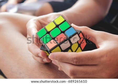 Rubik's play Royalty-Free Stock Photo #689265610