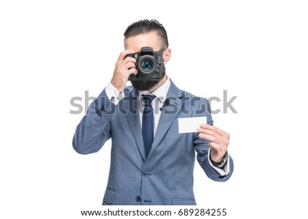 businessman in grey suit taking photo of empty card, isolated on white 