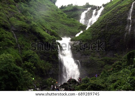 Tourist enjoy their weekend at Bhivpuri waterfall during the monsoon at Bhivpuri, Karjat district, Maharashtra, India Royalty-Free Stock Photo #689289745