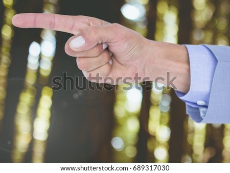 Digital composite of Hand pointing in forest