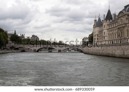 Bridge over the seine in paris with beautiful old historic buildings