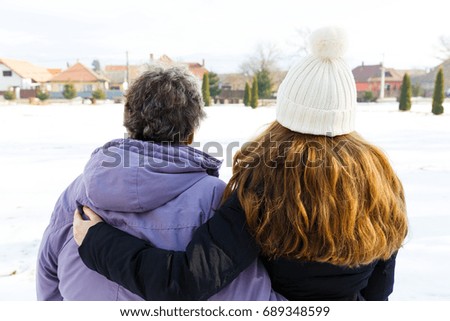 Photo of elderly woman and young caregiver 