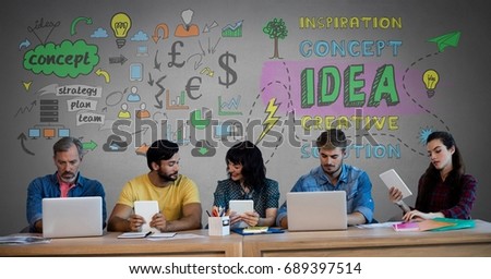 Digital composite of Group of people on devices in front of concept ideas graphics