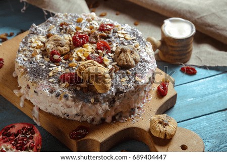 Homemade vegetarian pie with dried fruits on a blue background