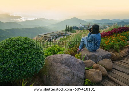 Tourist take a picture for beautiful Sunrise with Mountain view of travel place at Khao Kho Phetchabun Thailand.