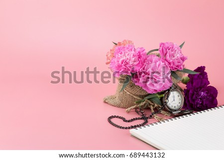 Pink Carnation blossom wrapped with calico with a heart shape made of watch strap, carry a love and refreshing hope.