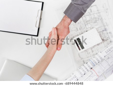 Businesswoman handshake businessman