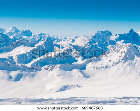 Amazing landscape. Beautiful winter in mountains. Country Russia Caucasus. Wonderful rocks and snow. Travel panorama. Nature background. Ski park in ice glacier.