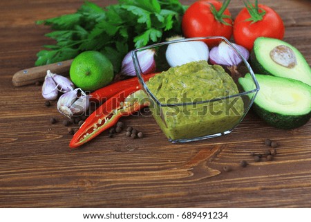 Ingredients for guacamole sauce,copy space ,dark wooden  background
