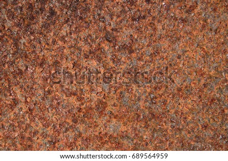 Texture, wallpaper, a layer of rusty iron. Close-up Horizontal photo