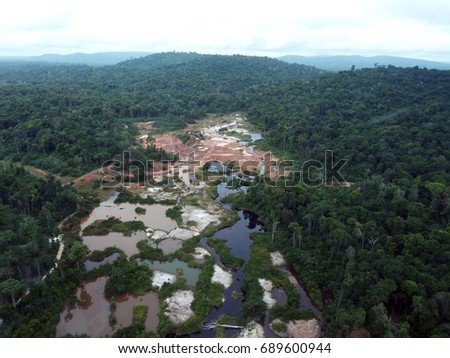 Rainforest destruction. Aerial photo of gold mining place in Guyana, South America.
Amazon and Essequibo basin deforestation. Brazil deforestation. Venezuela deforestation.