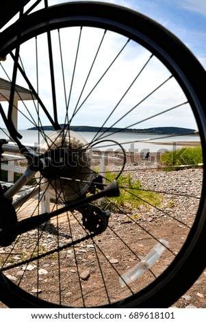 Beach and Beach Chair through the Bicycle Tire
