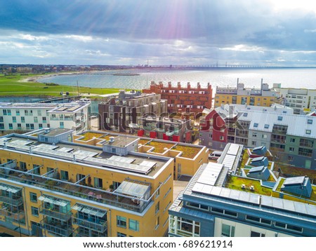 Aerial Malmo city view from above with harbour, turning Torso and the bridge on the horizon Royalty-Free Stock Photo #689621914