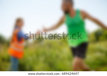 blurred Photo of athlete in T-shirt