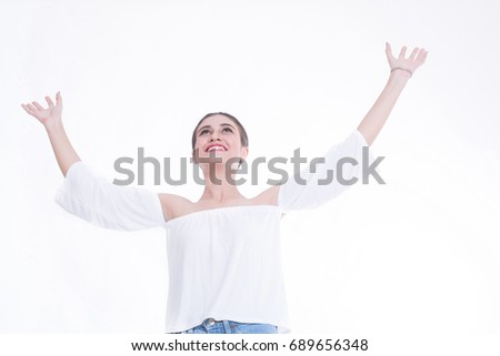 Portrait of Young happy winner woman isolated on white background.
