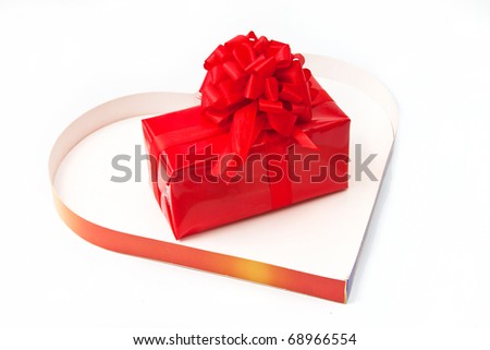 Red gift inside a heart box