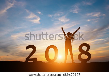 Silhouette of happy woman with New year 2018 concept in sunset background. Royalty-Free Stock Photo #689670127
