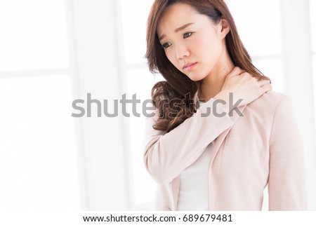 Beautiful young asian businesswoman,tired,