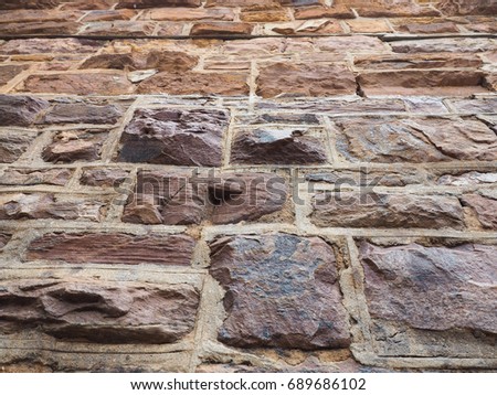 Texture background of old red brick wall that strong enough to stand through all these years