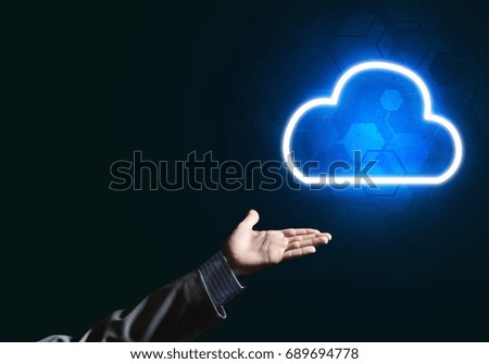 Businessman hand holding cloud computing concept in palm