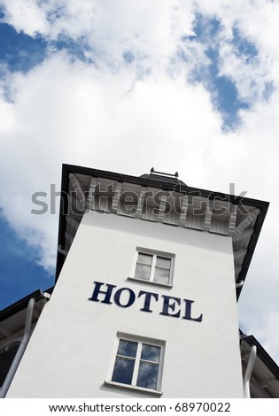 Hotel sign on white facade